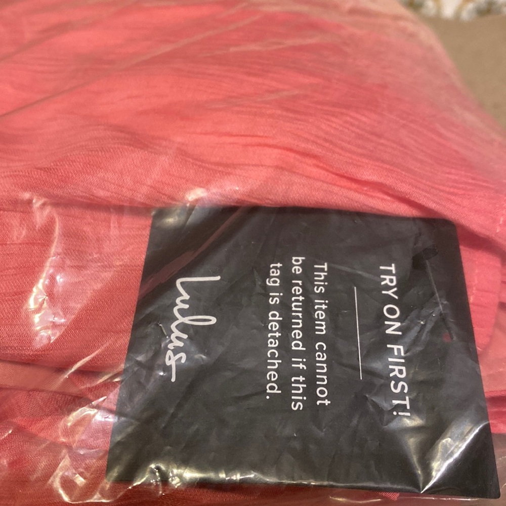 Brand new..just tried it on and it wont fit..I’m 4’9 and it just too long for me